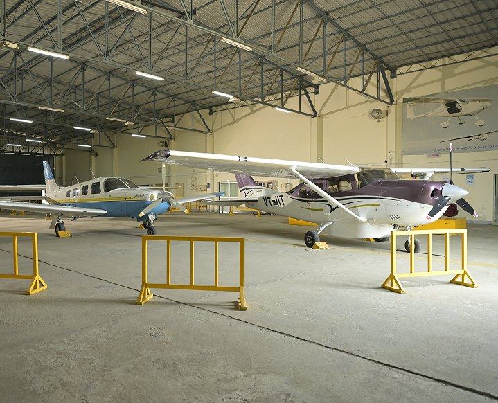A light aircraft inside a hangar
