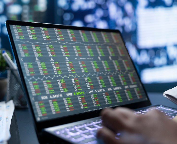 Financial market data on a laptop screen