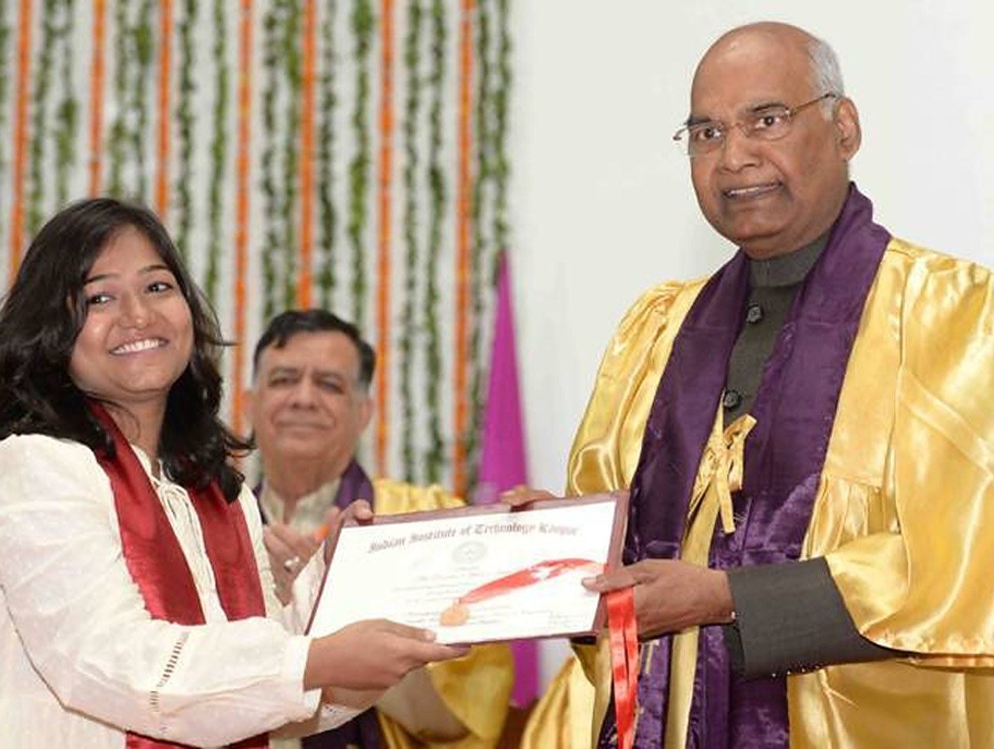 A student receiving an award at convocation