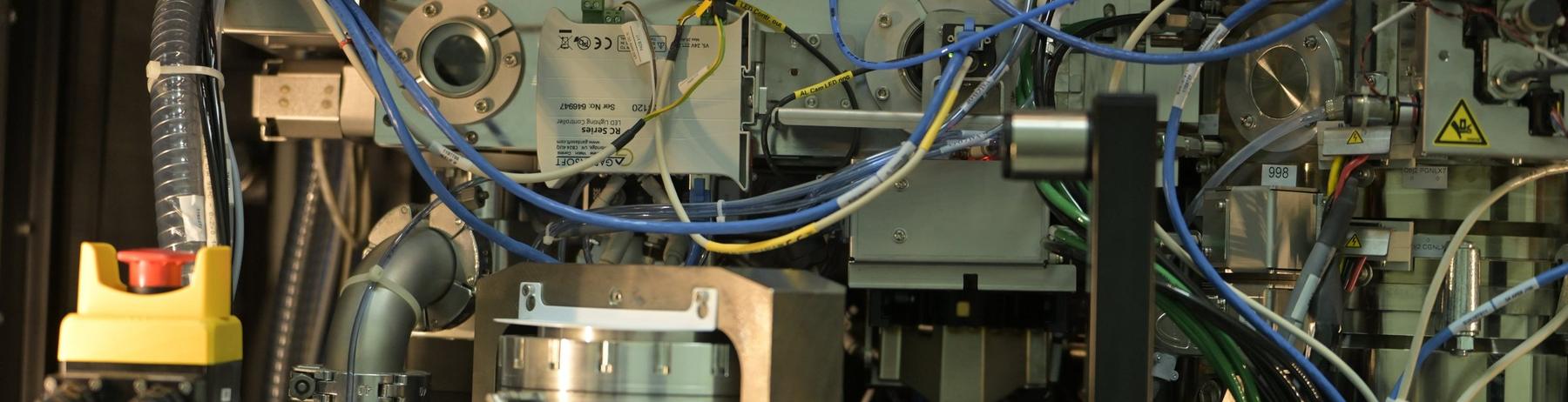 Close-up of a research instrument with cables and sensors
