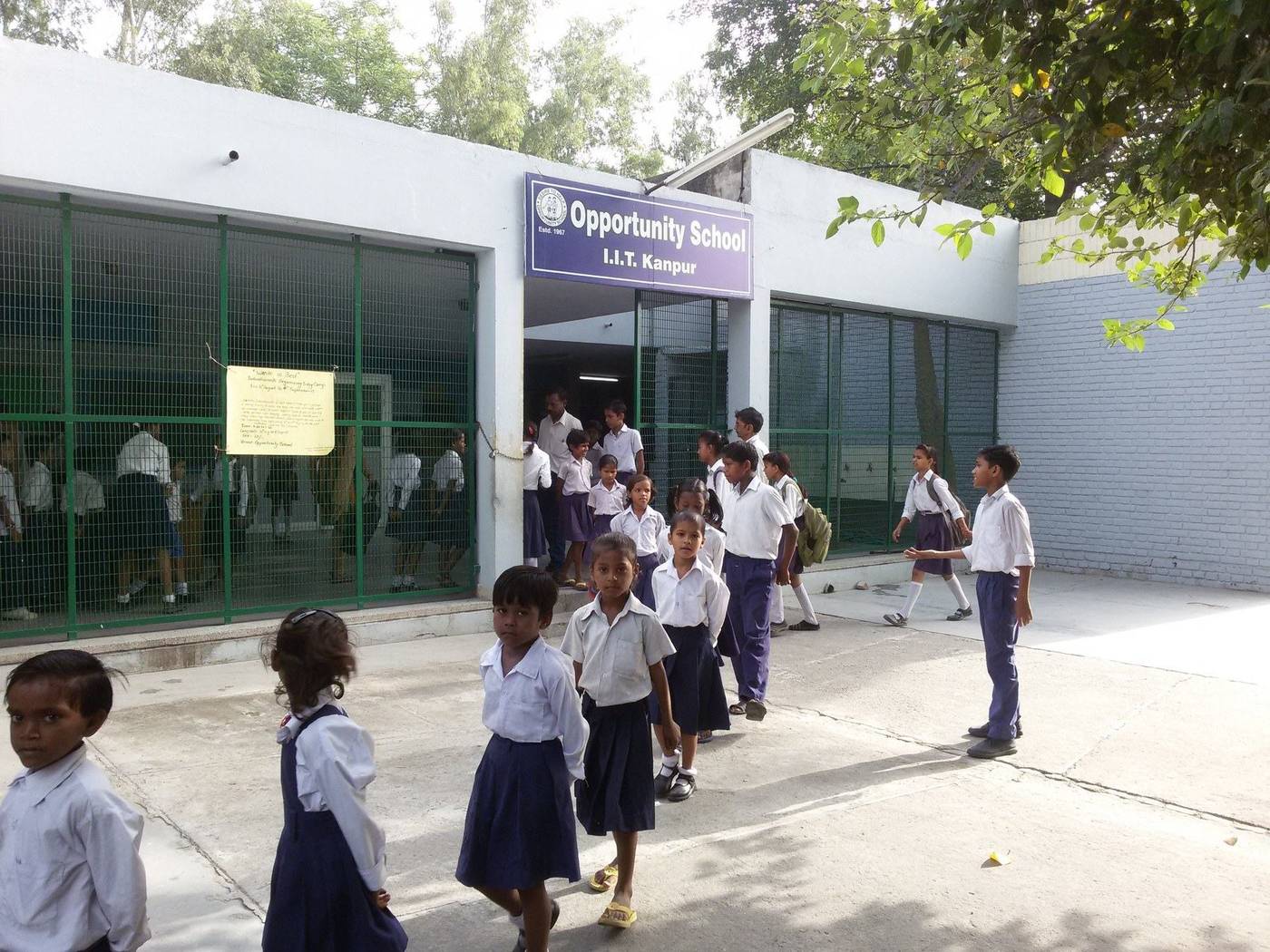 Students in uniform outside the Opportunity School building