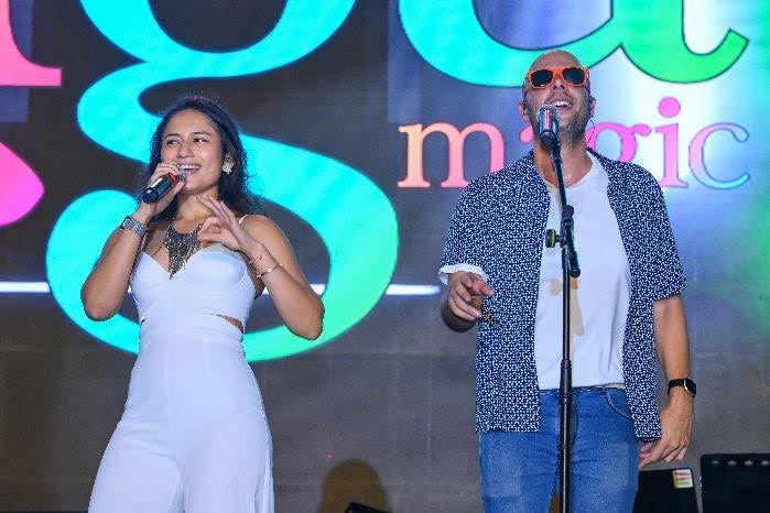 A person and person singing on stage

AI-generated content may be incorrect.