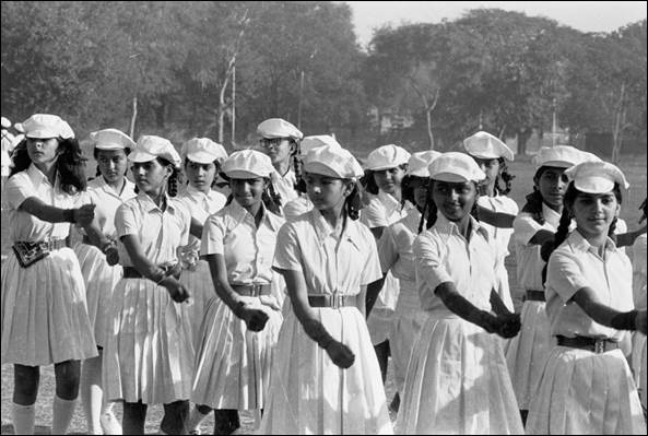 A group of young girls in white uniforms

AI-generated content may be incorrect.