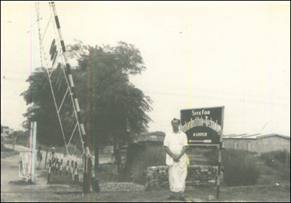 A person standing in front of a sign

AI-generated content may be incorrect.