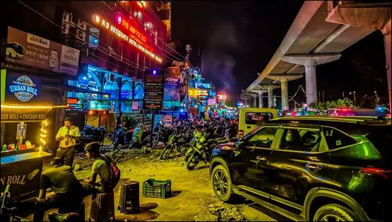 A group of people on a street with motorcycles and buildings

AI-generated content may be incorrect.