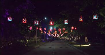 A street with lights from trees

AI-generated content may be incorrect.
