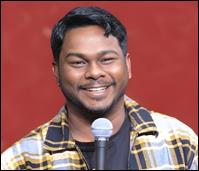 A person smiling with a microphone

AI-generated content may be incorrect.