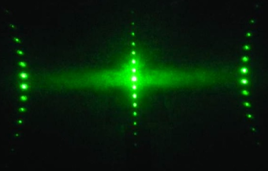 Laser diffraction from stretched hexagonal gratings